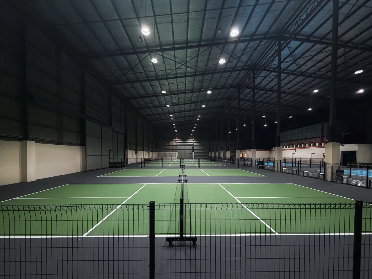The main hall at ATP Club, with the premium courts running the length of the building